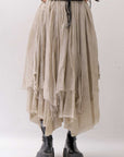 【sanctamuerte】 LAYERED ASYMMETRY SKIRT SM33_SAND SHELL