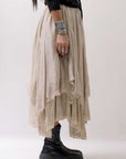 【sanctamuerte】 LAYERED ASYMMETRY SKIRT SM33_SAND SHELL