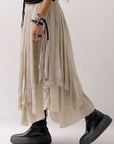 【sanctamuerte】 LAYERED ASYMMETRY SKIRT SM33_SAND SHELL