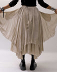 【sanctamuerte】 LAYERED ASYMMETRY SKIRT SM33_SAND SHELL